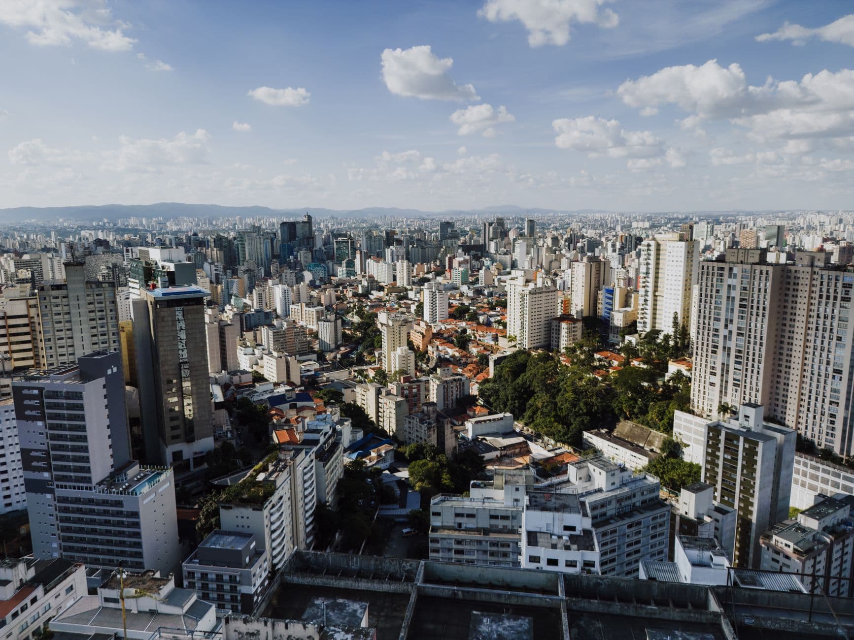 Stunning aerial view of São Paulo's sprawling cityscape with clear skies and modern skyscrapers.