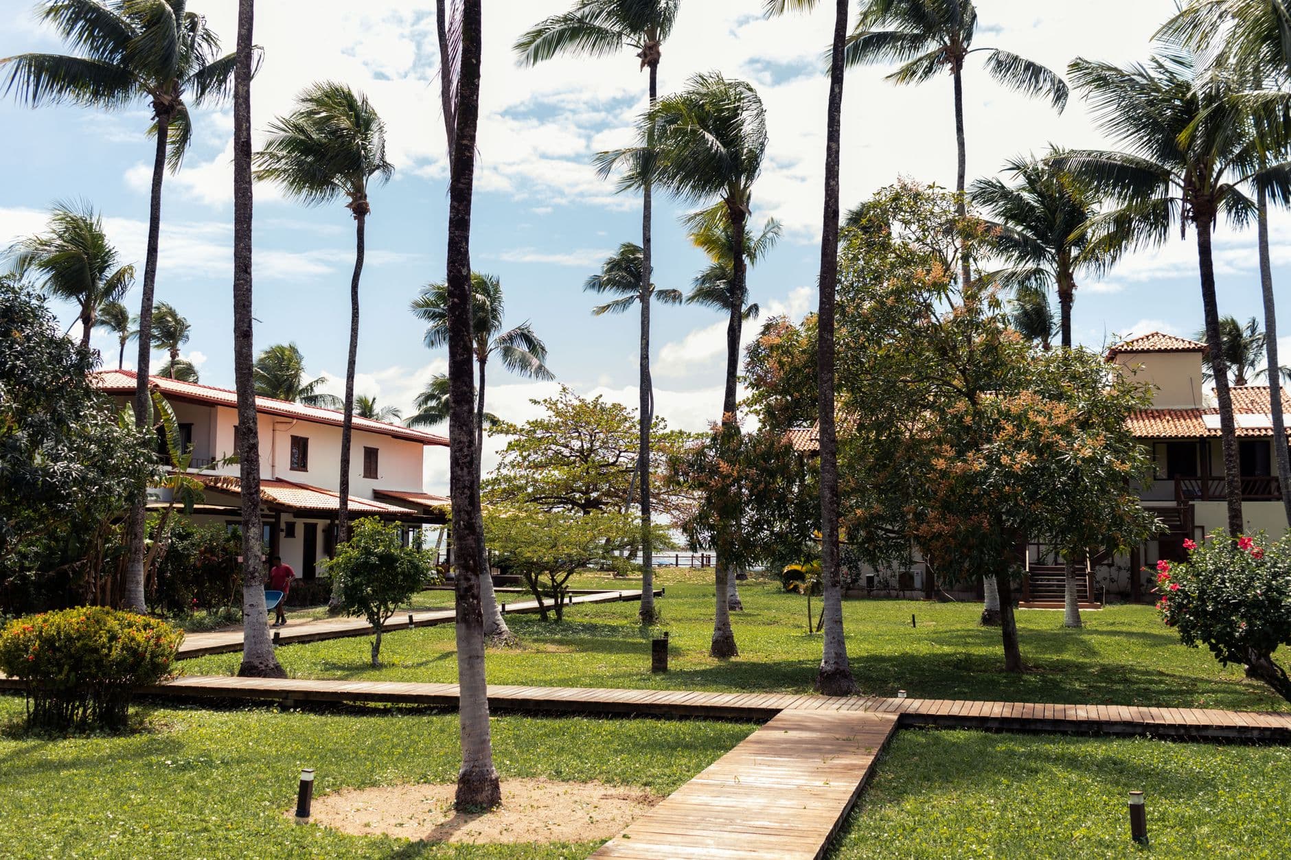 A scenic tropical resort amidst palm trees in Morro de São Paulo, Bahia, Brazil.