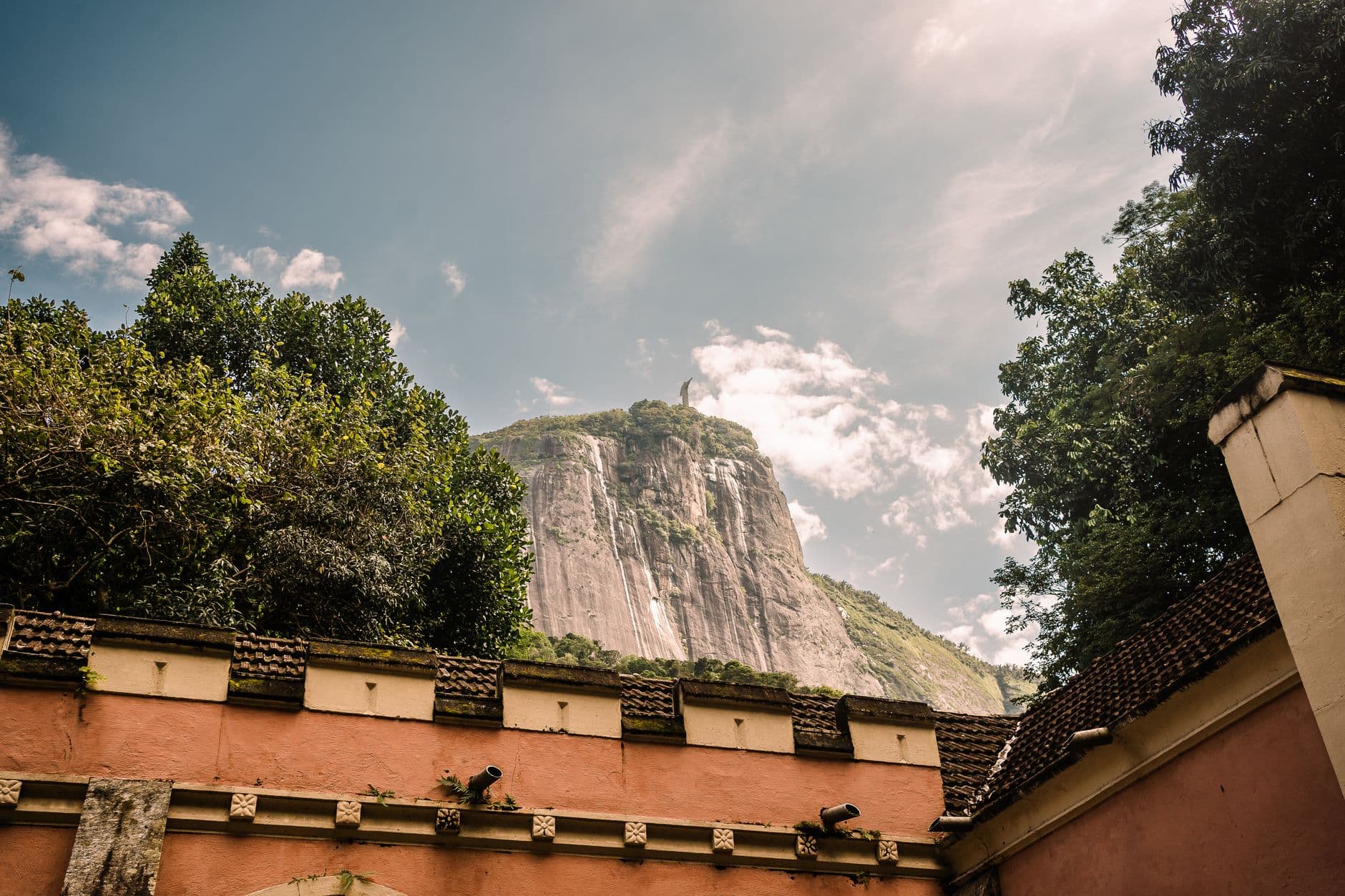 View of Christ the Redeemer statue from a classic rooftop in Rio de Janeiro, Brazil.
