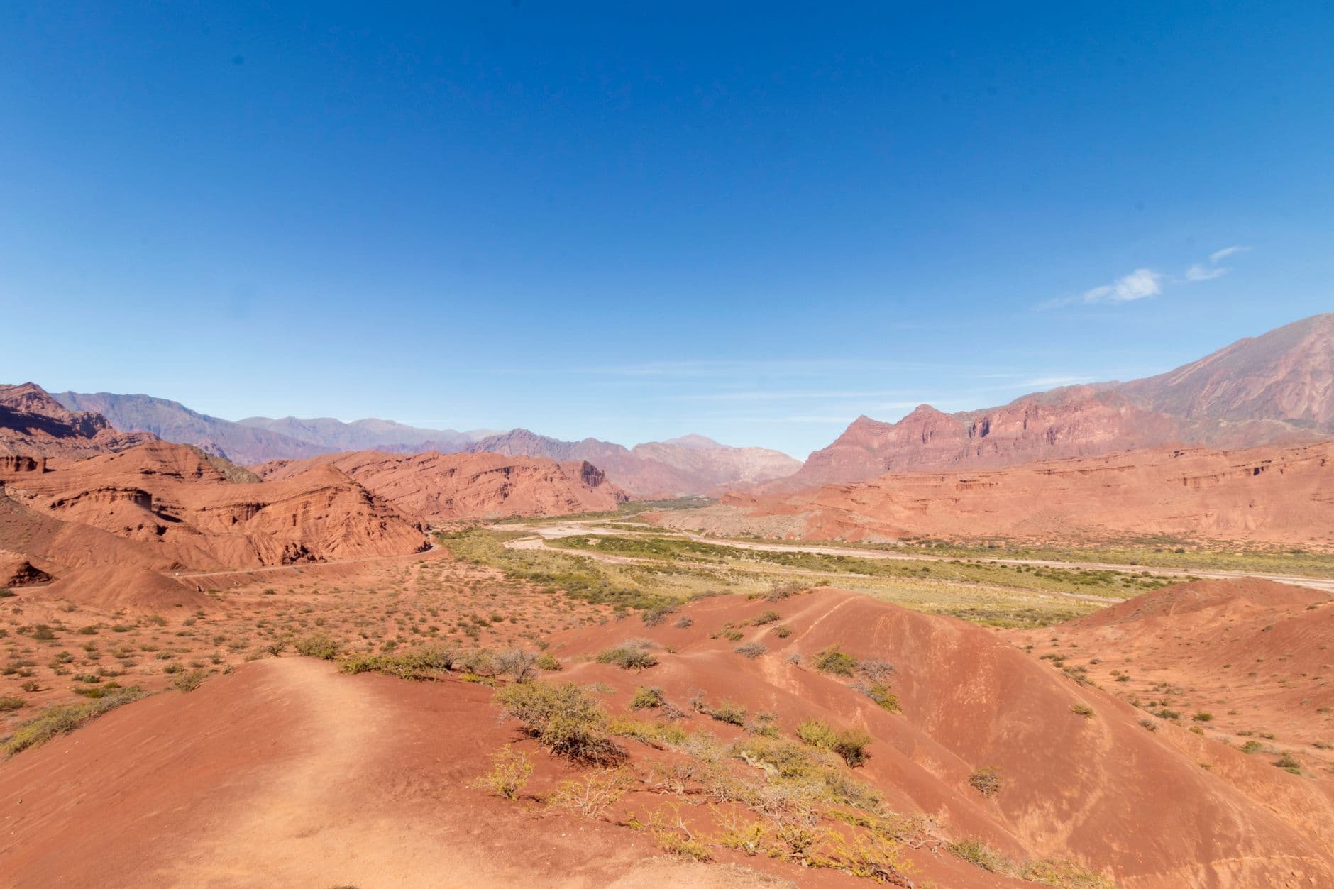 Breathtaking view of rugged red rock formations and desert landscape in Cafayate, Salta Province, Argentina.