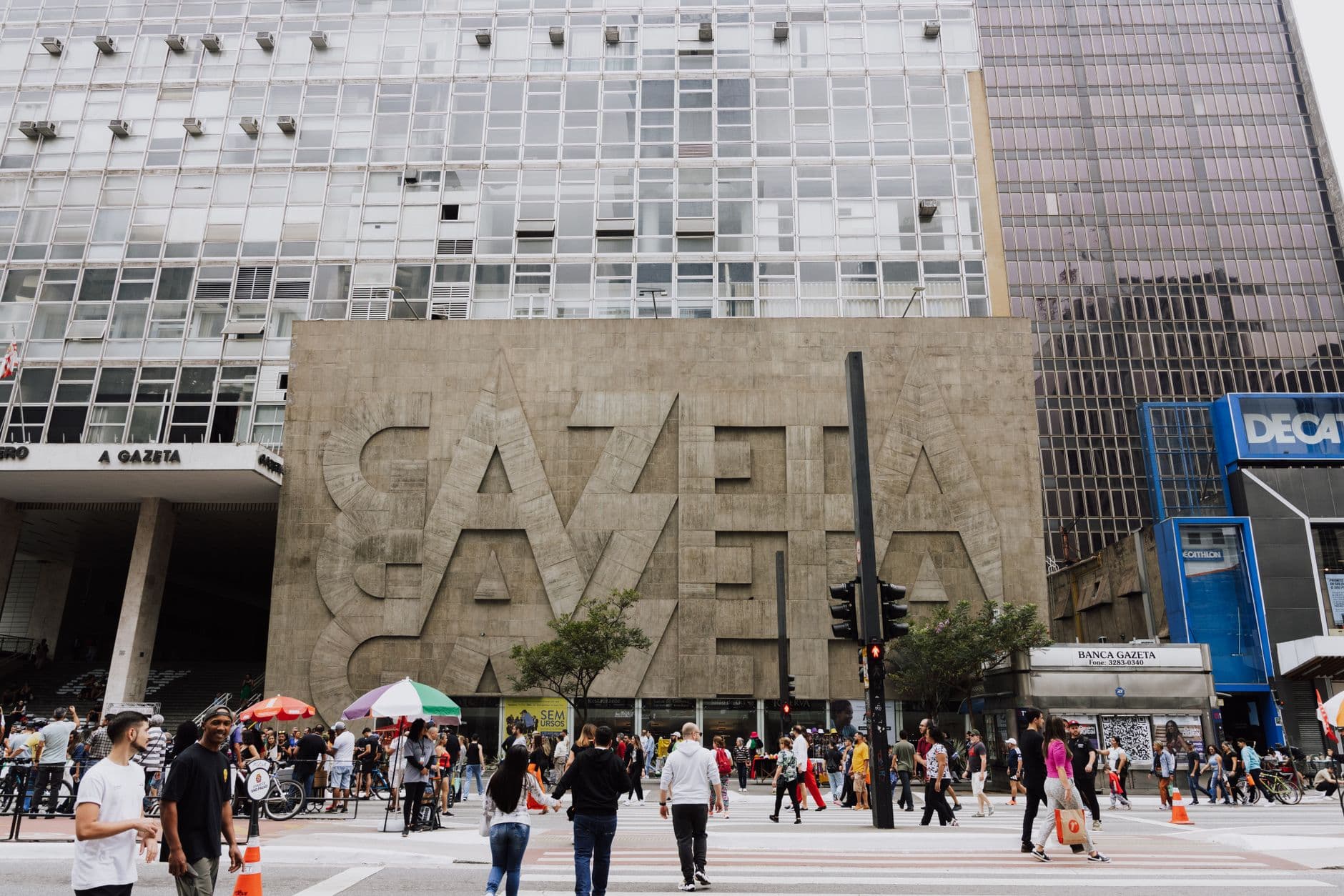 Crowded street view in front of Gazeta building on Paulista Avenue, São Paulo.