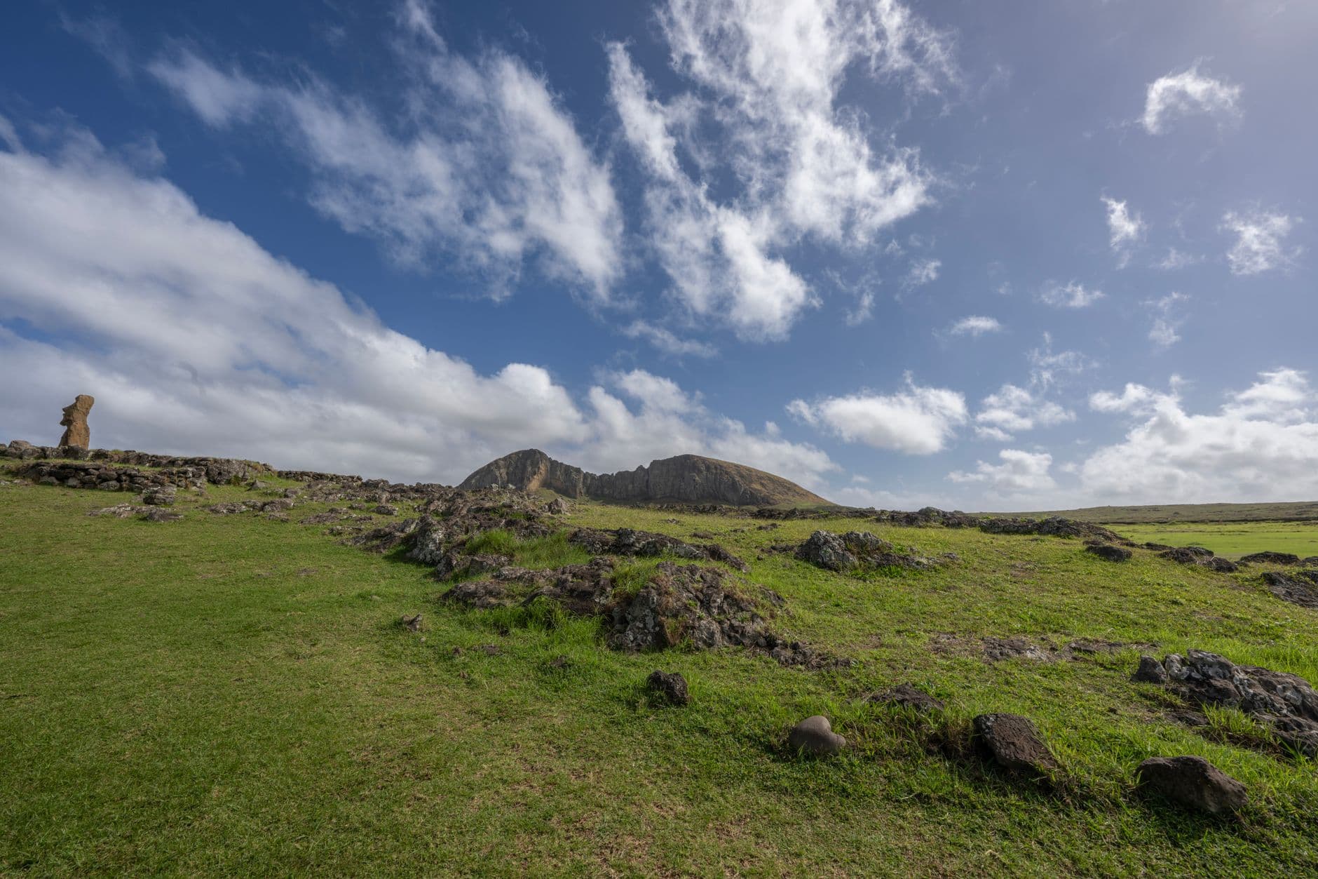 A stunning landscape view of a Moai statue at Rano Raraku on Easter Island.