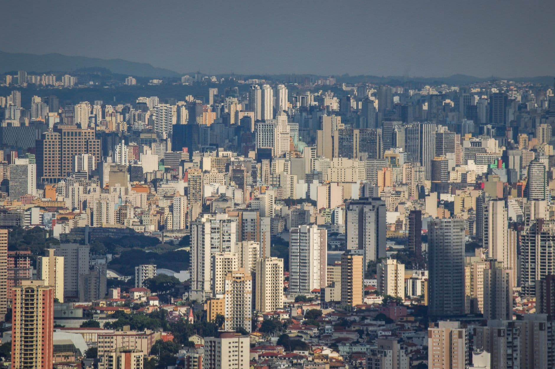 A sprawling view of São Paulo's dense skyline showcasing modern urban architecture under a clear sky.
