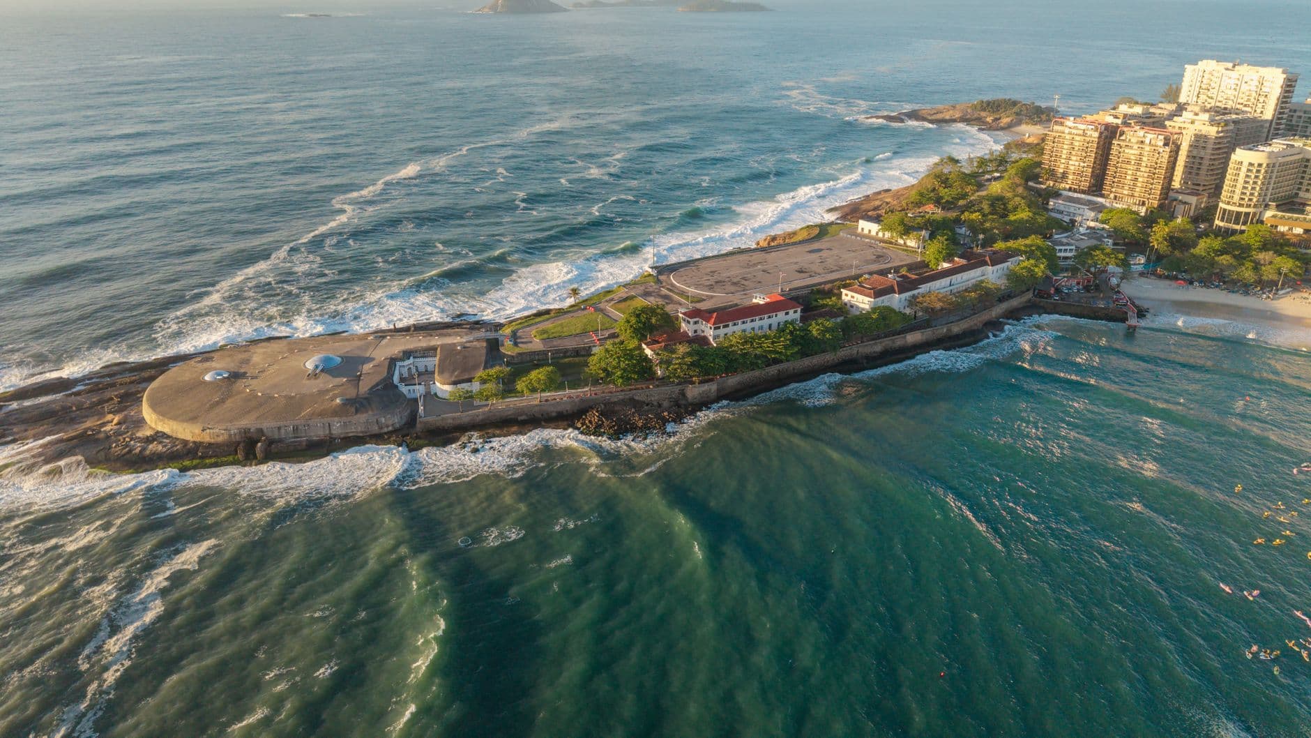A stunning aerial view of Fort Copacabana island surrounded by the sea in Rio de Janeiro, Brazil.