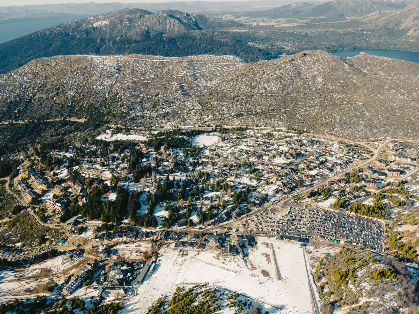 Snow-covered San Carlos de Bariloche from above, showcasing winter scenery.