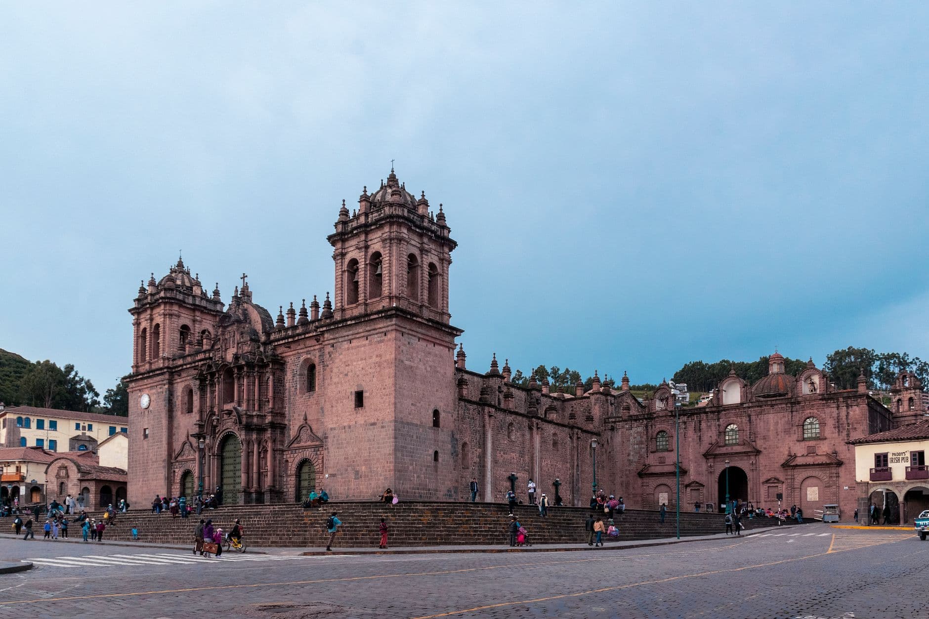 Beautiful view of Cusco Cathedral in Plaza de Armas with people walking around, Peru.